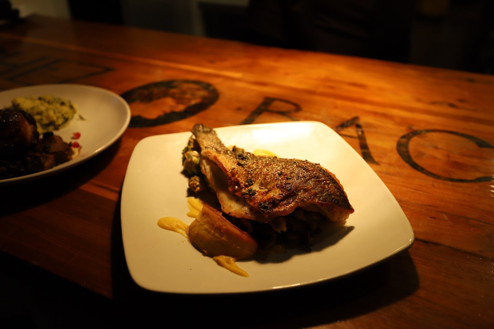 The communal Chef's Table at Chez Bacchus, set for an evening with Chef Danny Le